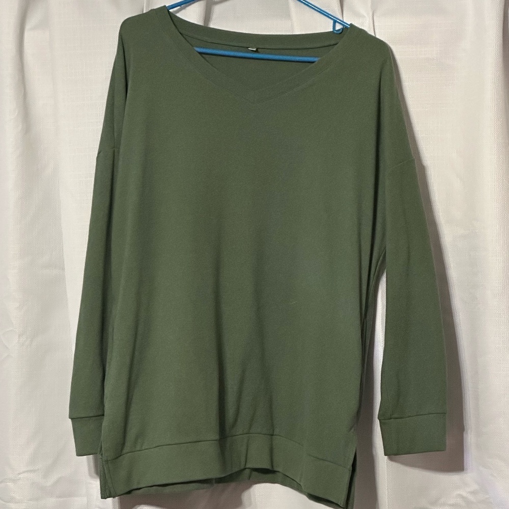 Green V-neck sweater with pockets
